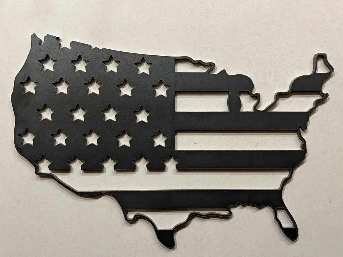 Metal cutout of the United States shaped as an American flag with star cutouts